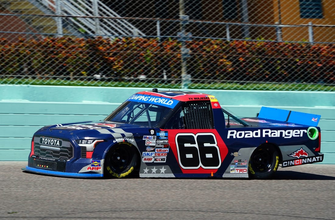 Oct 22, 2022; Homestead, Florida, USA; Camping World Truck Series driver Ty Majeski (66) races on the final lap winning the Baptist Health 200 at Homestead-Miami Speedway. Mandatory Credit: John David Mercer-USA TODAY Sports