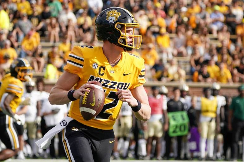 Oct 22, 2022; Columbia, Missouri, USA; Missouri Tigers quarterback Brady Cook (12) throws a pass against the Vanderbilt Commodores during the first half of the game at Faurot Field at Memorial Stadium. Mandatory Credit: Denny Medley-USA TODAY Sports