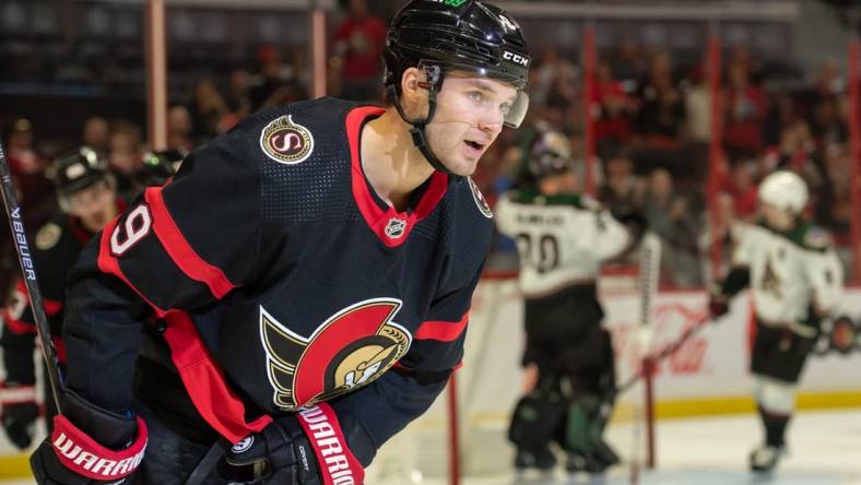 Oct 22, 2022; Ottawa, Ontario, CAN; Ottawa Senators center Josh Norris (9 skates back to the bench after scoring  in the first period against the Arizona Coyotes at the Canadian Tire Centre. Mandatory Credit: Marc DesRosiers-USA TODAY Sports