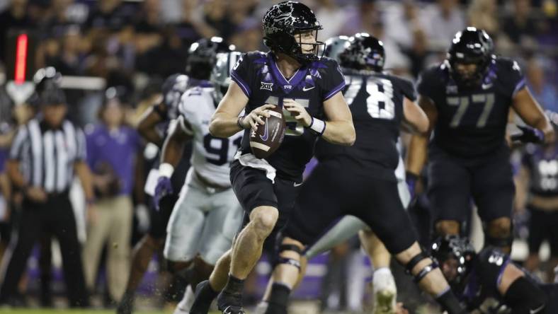 Oct 22, 2022; Fort Worth, Texas, USA; TCU Horned Frogs quarterback Max Duggan (15) rolls out to pass against the Kansas State Wildcats in the first quarter at Amon G. Carter Stadium. Mandatory Credit: Tim Heitman-USA TODAY Sports