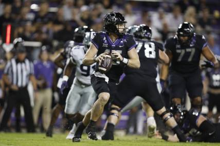 Oct 22, 2022; Fort Worth, Texas, USA; TCU Horned Frogs quarterback Max Duggan (15) rolls out to pass against the Kansas State Wildcats in the first quarter at Amon G. Carter Stadium. Mandatory Credit: Tim Heitman-USA TODAY Sports