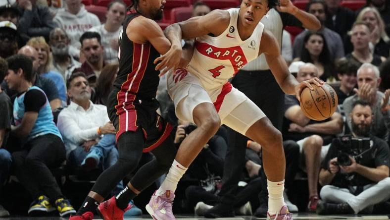 Oct 22, 2022; Miami, Florida, USA; Miami Heat guard Gabe Vincent (2) battles for position against Toronto Raptors forward Scottie Barnes (4) in the first half at FTX Arena. Mandatory Credit: Jim Rassol-USA TODAY Sports