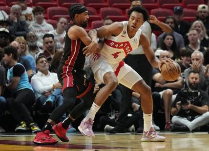 Oct 22, 2022; Miami, Florida, USA; Miami Heat guard Gabe Vincent (2) battles for position against Toronto Raptors forward Scottie Barnes (4) in the first half at FTX Arena. Mandatory Credit: Jim Rassol-USA TODAY Sports