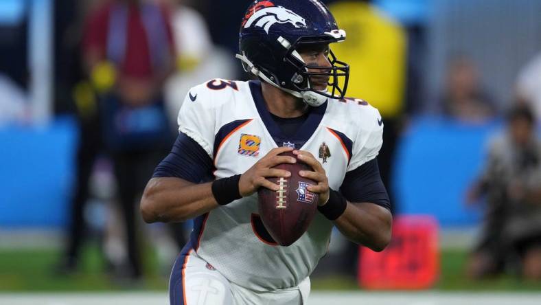 Oct 17, 2022; Inglewood, California, USA; Denver Broncos quarterback Russell Wilson (3) throws the ball in the first half against the Los Angeles Chargers at SoFi Stadium. Mandatory Credit: Kirby Lee-USA TODAY Sports