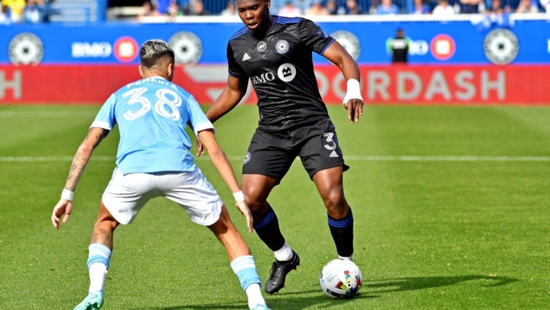 Oct 23, 2022; Montreal, Quebec, Canada; CF Montreal defender Kamal Miller (3) moves the ball against New York City midfielder Gabriel Pereira (38) during the conference semifinals for the Audi 2022 MLS Cup Playoffs at Stade Saputo. Mandatory Credit: Marc DesRosiers-USA TODAY Sports