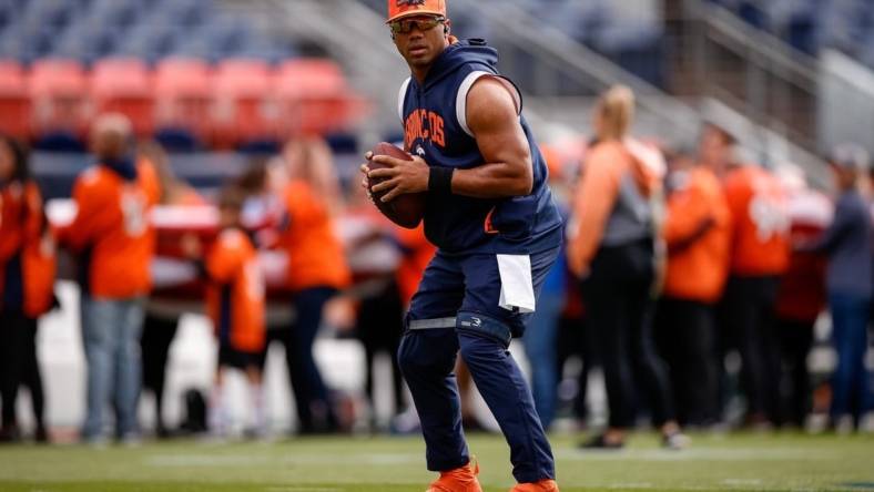 Oct 23, 2022; Denver, Colorado, USA; Denver Broncos quarterback Russell Wilson (3) stretches before the game against the New York Jets at Empower Field at Mile High. Mandatory Credit: Isaiah J. Downing-USA TODAY Sports