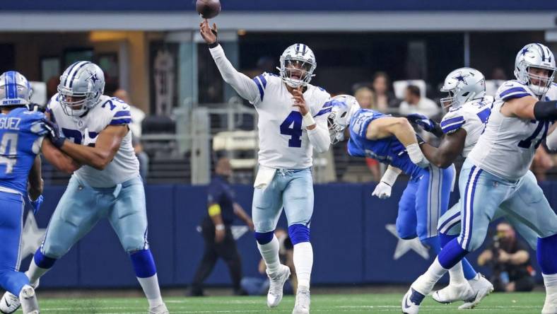 Oct 23, 2022; Arlington, Texas, USA;  Dallas Cowboys quarterback Dak Prescott (4) throws during the first half against the Detroit Lions at AT&T Stadium. Mandatory Credit: Kevin Jairaj-USA TODAY Sports