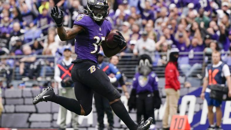 Oct 23, 2022; Baltimore, Maryland, USA;  Baltimore Ravens running back Gus Edwards (35) scores a touchdown against the Cleveland Browns during the first half at M&T Bank Stadium. Mandatory Credit: Jessica Rapfogel-USA TODAY Sports