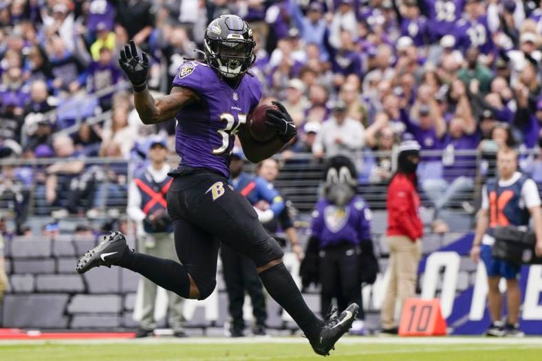Oct 23, 2022; Baltimore, Maryland, USA;  Baltimore Ravens running back Gus Edwards (35) scores a touchdown against the Cleveland Browns during the first half at M&T Bank Stadium. Mandatory Credit: Jessica Rapfogel-USA TODAY Sports