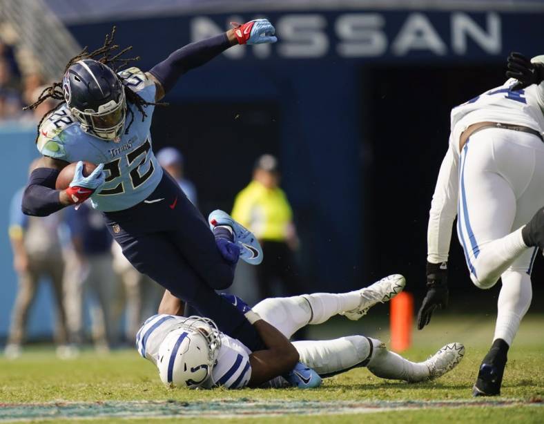 Oct 23, 2022; Nashville, Tennessee, USA; Tennessee Titans running back Derrick Henry (22) is tackled by Indianapolis Colts linebacker E.J. Speed (45) during the third quarter at Nissan Stadium Sunday, Oct. 23, 2022, in Nashville, Tenn.  Mandatory Credit: Andrew Nelles-USA TODAY Sports