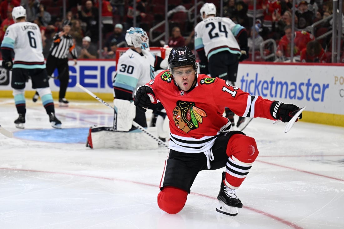 Oct 23, 2022; Chicago, Illinois, USA;  Chicago Blackhawks forward Max Domi (13) celebrates his power play goal in the second period against the Seattle Kraken at United Center. Mandatory Credit: Jamie Sabau-USA TODAY Sports