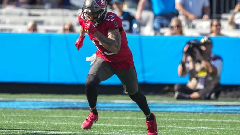 Oct 23, 2022; Charlotte, North Carolina, USA; Tampa Bay Buccaneers wide receiver Mike Evans (13) starts his route against the Carolina Panthers during the second half at Bank of America Stadium. Mandatory Credit: Jim Dedmon-USA TODAY Sports