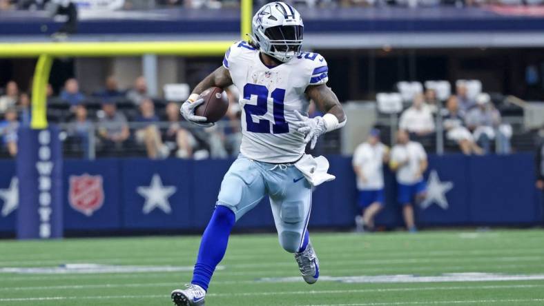 Oct 23, 2022; Arlington, Texas, USA;  Dallas Cowboys running back Ezekiel Elliott (21) runs with the ball during the first half against the Detroit Lions at AT&T Stadium. Mandatory Credit: Kevin Jairaj-USA TODAY Sports