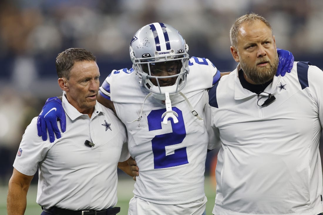 Oct 23, 2022; Arlington, Texas, USA; Dallas Cowboys cornerback Jourdan Lewis (2) is helped off the field by medical staff members in the fourth quarter against the Detroit Lions at AT&T Stadium. Mandatory Credit: Tim Heitman-USA TODAY Sports