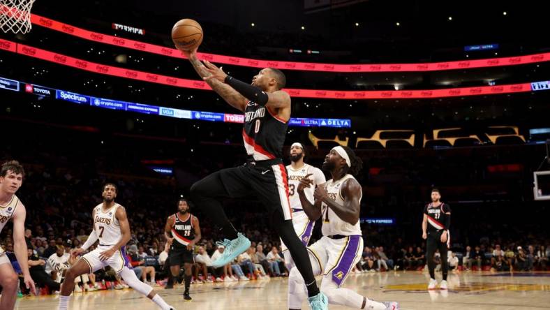 Oct 23, 2022; Los Angeles, California, USA;  Portland Trail Blazers guard Damian Lillard (0) goes to the basket during the second quarter against the Los Angeles Lakers at Crypto.com Arena. Mandatory Credit: Kiyoshi Mio-USA TODAY Sports