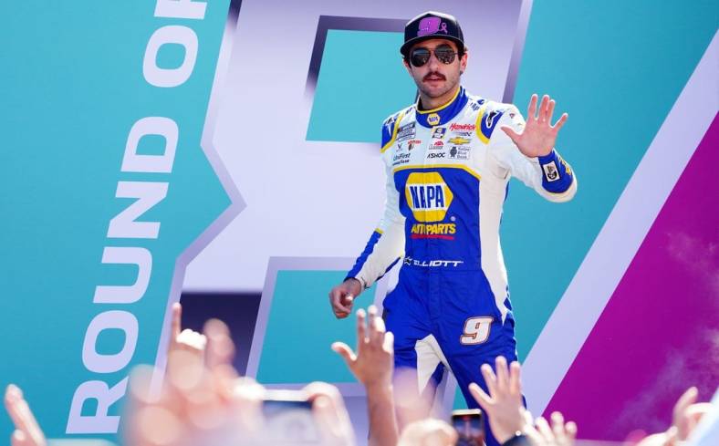Oct 23, 2022; Homestead, Florida, USA; NASCAR Cup Series driver Chase Elliott (9) waves to the race fans along the front stretch before the Dixie Vodka 400 at Homestead-Miami Speedway. Mandatory Credit: John David Mercer-USA TODAY Sports