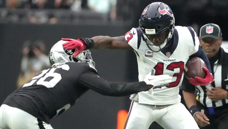 Oct 23, 2022; Paradise, Nevada, USA; Houston Texans wide receiver Brandin Cooks (13) is pursued by Las Vegas Raiders cornerback Rock Ya-Sin (26) in the first half at Allegiant Stadium. Mandatory Credit: Kirby Lee-USA TODAY Sports