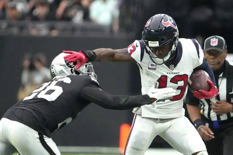 Oct 23, 2022; Paradise, Nevada, USA; Houston Texans wide receiver Brandin Cooks (13) is pursued by Las Vegas Raiders cornerback Rock Ya-Sin (26) in the first half at Allegiant Stadium. Mandatory Credit: Kirby Lee-USA TODAY Sports
