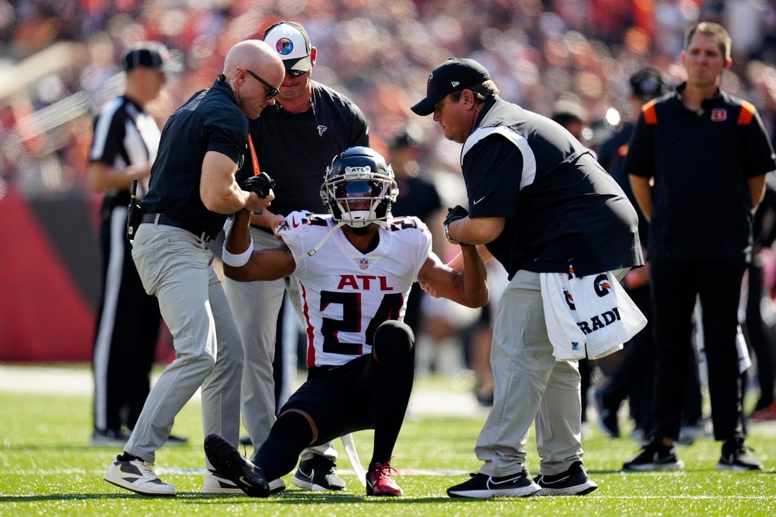 Atlanta Falcons cornerback A.J. Terrell (24) is helped to his feet after going down with a non-contact injury in the first quarter of the NFL Week 7 game between the Cincinnati Bengals and the Atlanta Falcons at Paycor Stadium in downtown Cincinnati on Sunday, Oct. 23, 2022. The Bengals led 28-17 at halftime. 


Mandatory Credit: Sam Greene-The Enquirer

Atlanta Falcons At Cincinnati Bengals Nfl Week 7