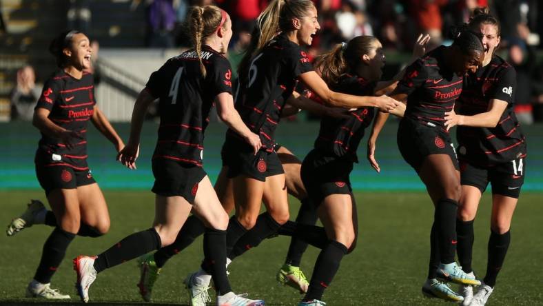 Oct 23, 2022; Portland, Oregon, USA; The Portland Thorns FC celebrate the win over San Diego Wave FC during the semifinals of the 2022 NWSL Playoffs at Providence Park. Mandatory Credit: Craig Mitchelldyer-USA TODAY Sports