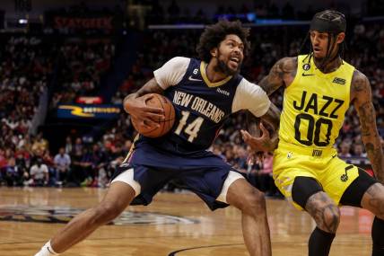 Oct 23, 2022; New Orleans, Louisiana, USA; New Orleans Pelicans forward Brandon Ingram (14) dribbles against Utah Jazz guard Jordan Clarkson (00) during the first half at Smoothie King Center. Mandatory Credit: Stephen Lew-USA TODAY Sports