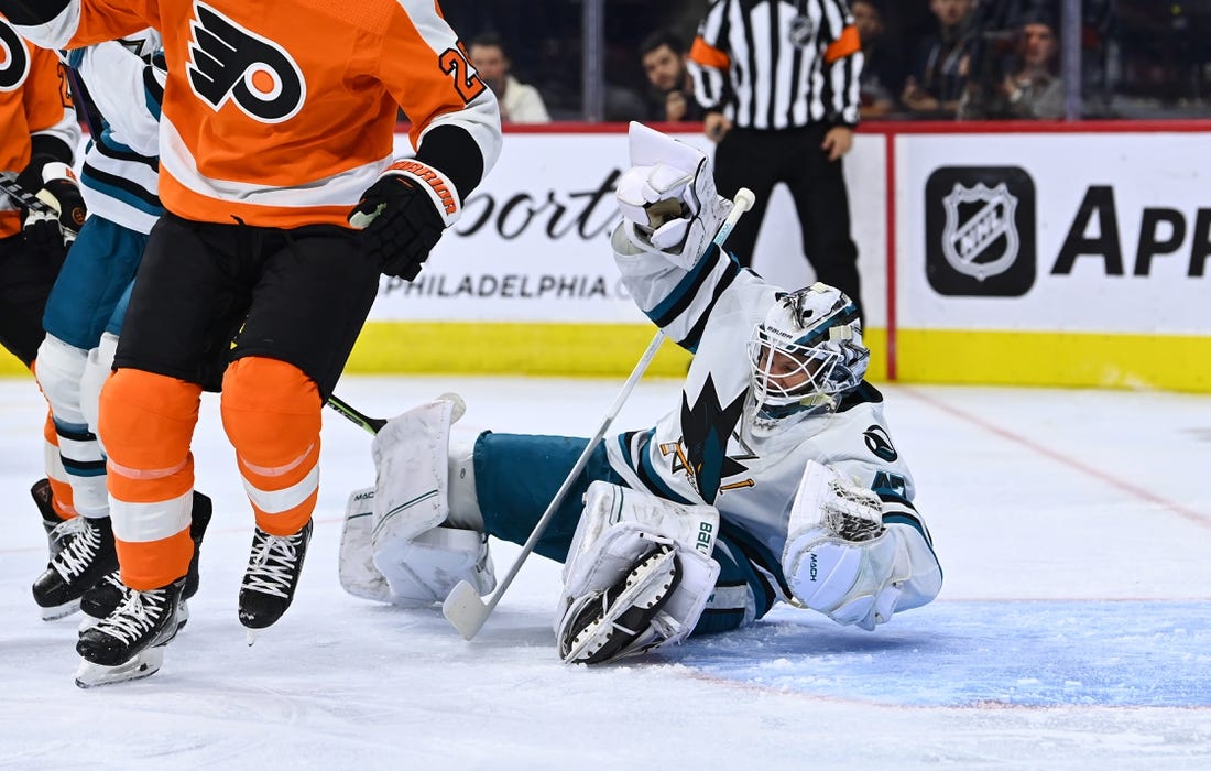 Oct 23, 2022; Philadelphia, Pennsylvania, USA; San Jose Sharks goalie James Reimer (47) dives against the Philadelphia Flyers in the first period at Wells Fargo Center. Mandatory Credit: Kyle Ross-USA TODAY Sports