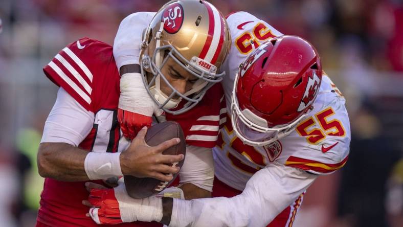 October 23, 2022; Santa Clara, California, USA; Kansas City Chiefs defensive end Frank Clark (55) tackles San Francisco 49ers quarterback Jimmy Garoppolo (10) for a safety during the fourth quarter at Levi's Stadium. Mandatory Credit: Kyle Terada-USA TODAY Sports