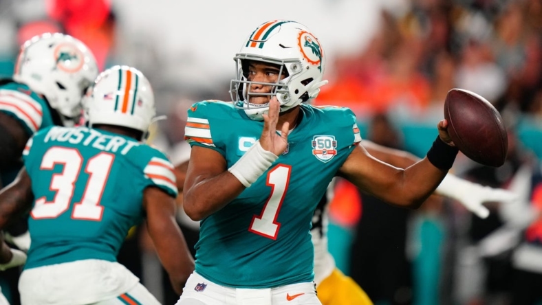 Oct 23, 2022; Miami Gardens, Florida, USA; Miami Dolphins quarterback Tua Tagovailoa (1) throws a pass against the Pittsburgh Steelers during the second quarter at Hard Rock Stadium. Mandatory Credit: Rich Storry-USA TODAY Sports