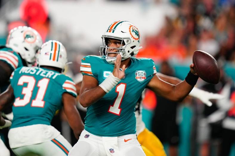 Oct 23, 2022; Miami Gardens, Florida, USA; Miami Dolphins quarterback Tua Tagovailoa (1) throws a pass against the Pittsburgh Steelers during the second quarter at Hard Rock Stadium. Mandatory Credit: Rich Storry-USA TODAY Sports