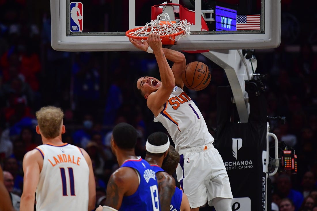 Oct 23, 2022; Los Angeles, California, USA; Phoenix Suns guard Devin Booker (1) dunks for a basket against the Los Angeles Clippers during the second half at Crypto.com Arena. Mandatory Credit: Gary A. Vasquez-USA TODAY Sports