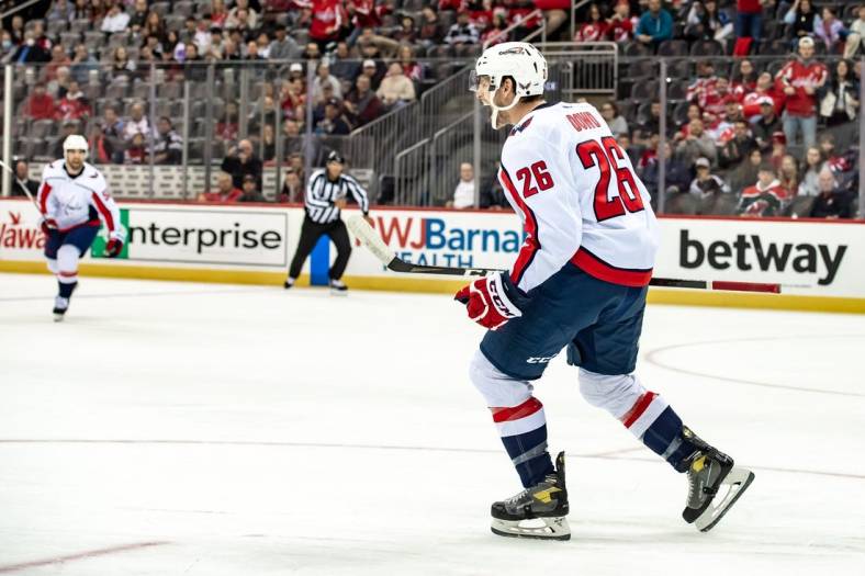 Oct 24, 2022; Newark, New Jersey, USA; Washington Capitals center Nic Dowd (26) reacts after scoring a goal against the New Jersey Devils during the first period at Prudential Center. Mandatory Credit: John Jones-USA TODAY Sports