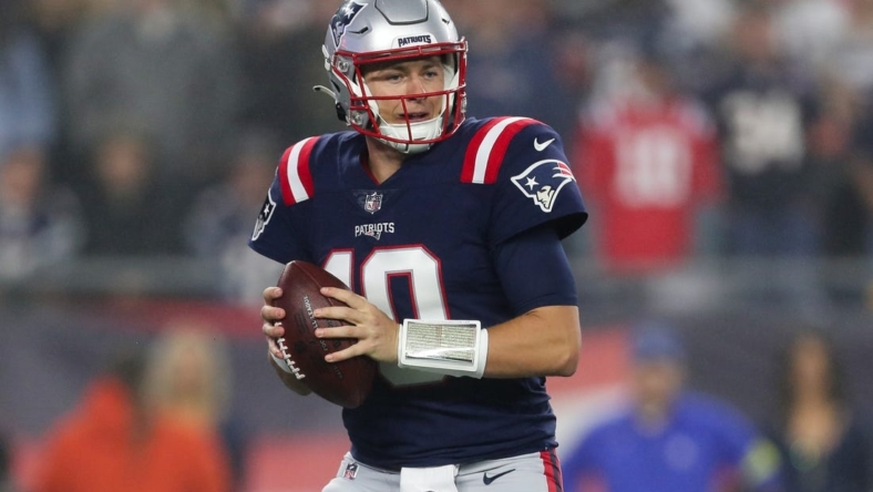 Oct 24, 2022; Foxborough, Massachusetts, USA; New England Patriots quarterback Mac Jones (10) drops back to pass during the first half against the Chicago Bears at Gillette Stadium. Mandatory Credit: Paul Rutherford-USA TODAY Sports