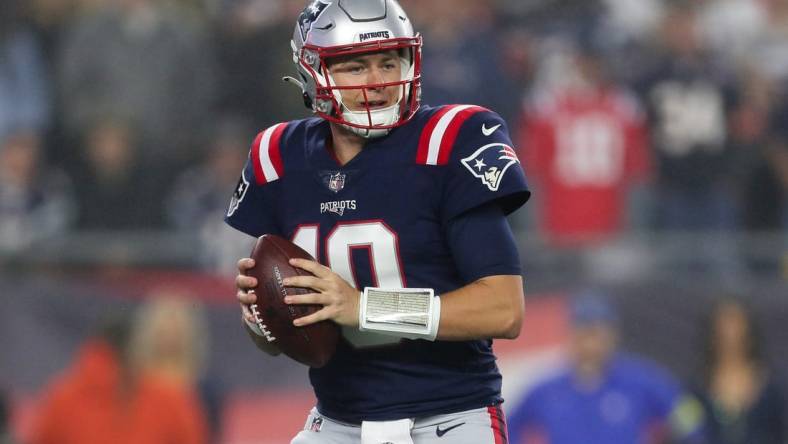 Oct 24, 2022; Foxborough, Massachusetts, USA; New England Patriots quarterback Mac Jones (10) drops back to pass during the first half against the Chicago Bears at Gillette Stadium. Mandatory Credit: Paul Rutherford-USA TODAY Sports