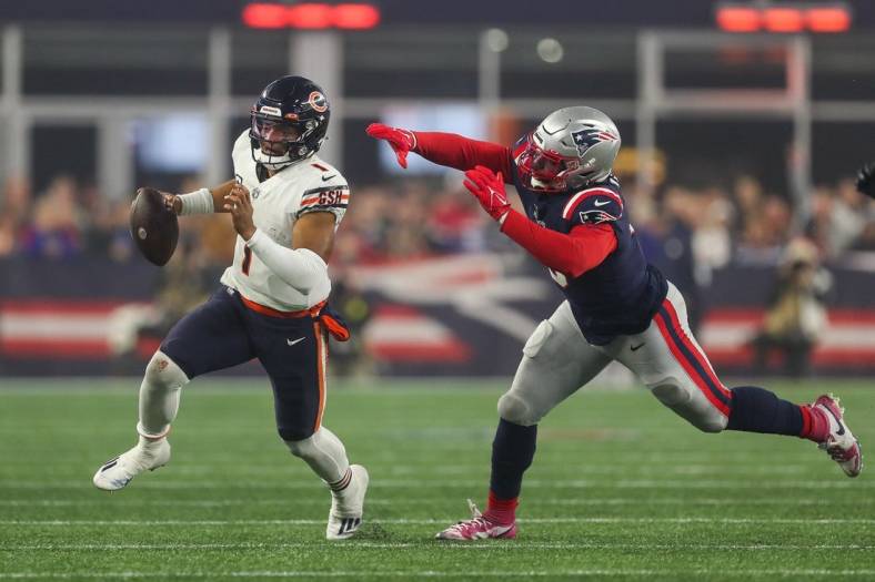 Oct 24, 2022; Foxborough, Massachusetts, USA; New England Patriots outside linebacker Matt Judon (9) chase down Chicago Bears quarterback Justin Fields (1) during the first half at Gillette Stadium. Mandatory Credit: Paul Rutherford-USA TODAY Sports