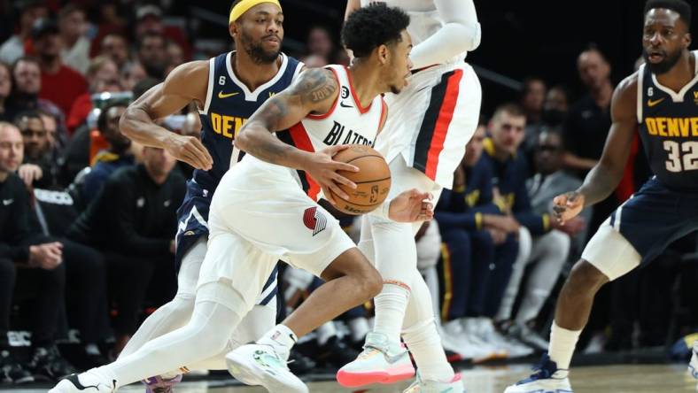 Oct 24, 2022; Portland, Oregon, USA;  Portland Trail Blazers guard Anfernee Simons (1) dribbles against the Denver Nuggets in the second half at Moda Center. Mandatory Credit: Jaime Valdez-USA TODAY Sports