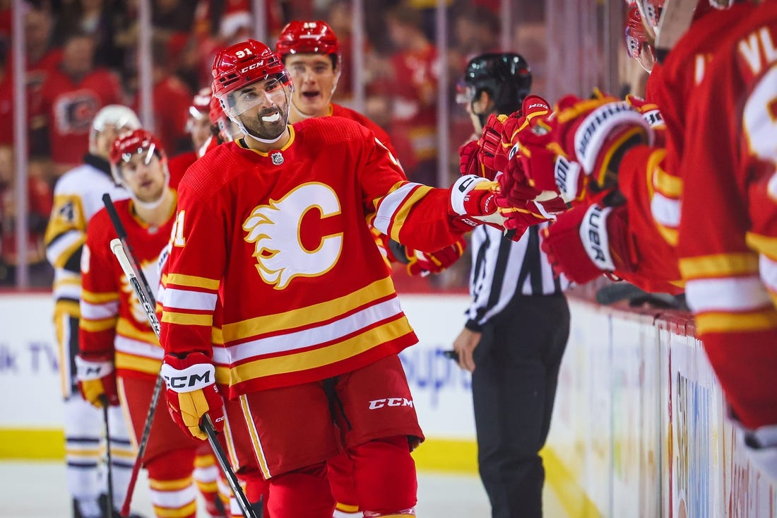 Oct 25, 2022; Calgary, Alberta, CAN; Calgary Flames center Nazem Kadri (91) celebrates his goal with teammates against the Pittsburgh Penguins during the first period at Scotiabank Saddledome. Mandatory Credit: Sergei Belski-USA TODAY Sports