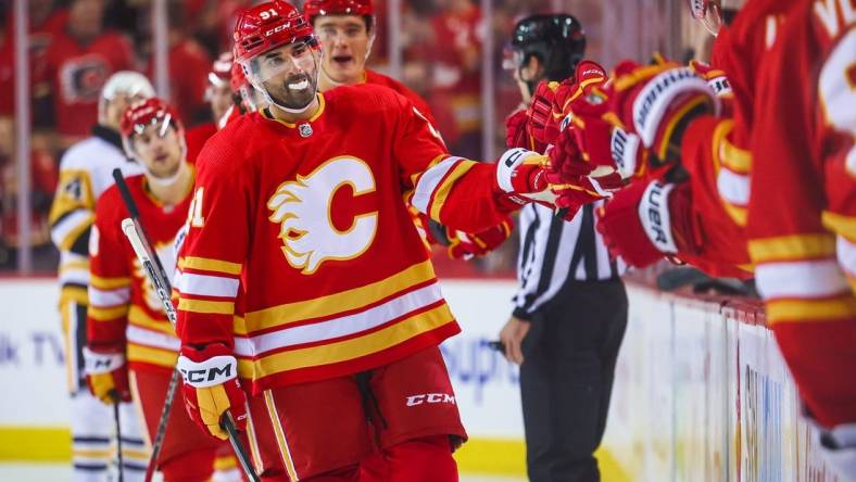 Oct 25, 2022; Calgary, Alberta, CAN; Calgary Flames center Nazem Kadri (91) celebrates his goal with teammates against the Pittsburgh Penguins during the first period at Scotiabank Saddledome. Mandatory Credit: Sergei Belski-USA TODAY Sports