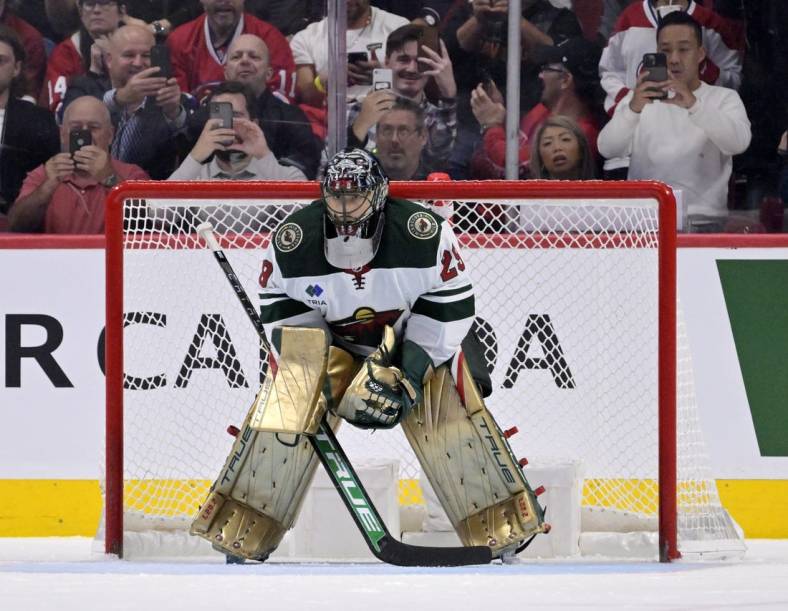 Oct 25, 2022; Montreal, Quebec, CAN; Fans reach for their cell phones while Minnesota Wild goalie Marc-Andre Fleury (29) prepares for a penalty shot during the third period of the game against the Montreal Canadiens at the Bell Centre. Mandatory Credit: Eric Bolte-USA TODAY Sports