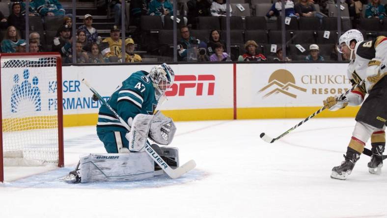 Oct 25, 2022; San Jose, California, USA; Las Vegas Golden Knights right winger Phil Kessel (8) puts the puck past San Jose Sharks goaltender James Reimer (47) for a goal during the first period at SAP Center at San Jose. Mandatory Credit: D. Ross Cameron-USA TODAY Sports