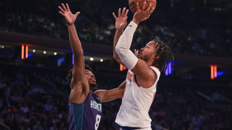Oct 26, 2022; New York, New York, USA; New York Knicks guard Jalen Brunson (11) shoots the ball as Charlotte Hornets guard Dennis Smith Jr. (8) defends during the first half at Madison Square Garden. Mandatory Credit: Vincent Carchietta-USA TODAY Sports