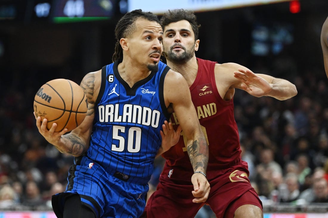 Oct 26, 2022; Cleveland, Ohio, USA; Orlando Magic guard Cole Anthony (50) drives to the basket against Cleveland Cavaliers guard Raul Neto (19) during the first half at Rocket Mortgage FieldHouse. Mandatory Credit: Ken Blaze-USA TODAY Sports