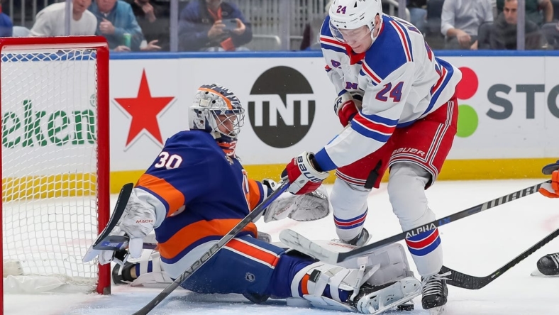 Oct 26, 2022; Elmont, New York, USA; New York Islanders goaltender Ilya Sorokin (30) makes a save against New York Rangers right wing Kaapo Kakko (24) during the first period at UBS Arena. Mandatory Credit: Tom Horak-USA TODAY Sports
