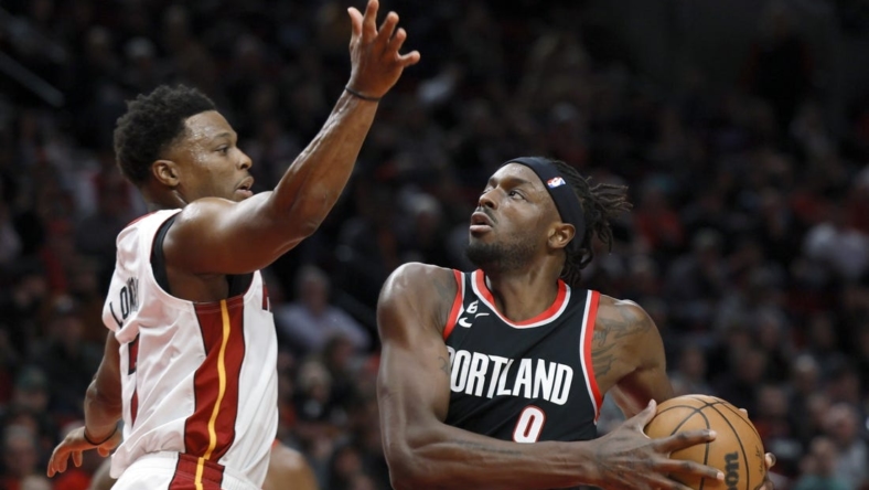 Oct 26, 2022; Portland, Oregon, USA; Portland Trail Blazers small forward Jerami Grant (9) drives to the basket against  Miami Heat point guard Kyle Lowry (7) during the first half at Moda Center. Mandatory Credit: Soobum Im-USA TODAY Sports