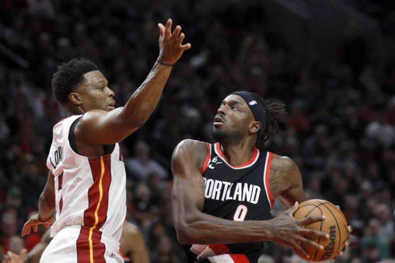 Oct 26, 2022; Portland, Oregon, USA; Portland Trail Blazers small forward Jerami Grant (9) drives to the basket against  Miami Heat point guard Kyle Lowry (7) during the first half at Moda Center. Mandatory Credit: Soobum Im-USA TODAY Sports