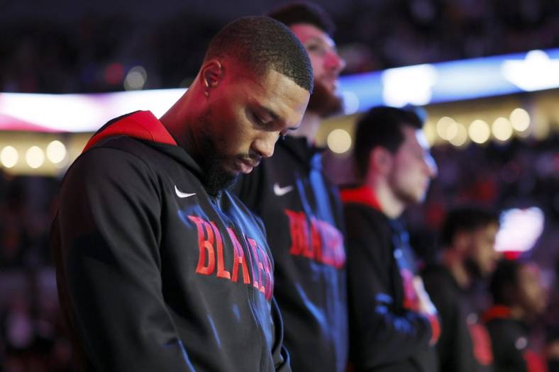 Oct 26, 2022; Portland, Oregon, USA; Portland Trail Blazers point guard Damian Lillard (0) stands during the national anthem before the game  against the Miami Heat  at Moda Center. Mandatory Credit: Soobum Im-USA TODAY Sports