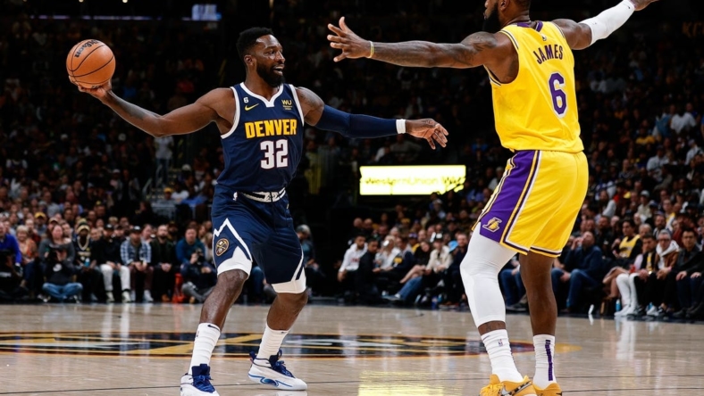 Oct 26, 2022; Denver, Colorado, USA; Denver Nuggets forward Jeff Green (32) controls the ball as Los Angeles Lakers forward LeBron James (6) guards in the fourth quarter at Ball Arena. Mandatory Credit: Isaiah J. Downing-USA TODAY Sports