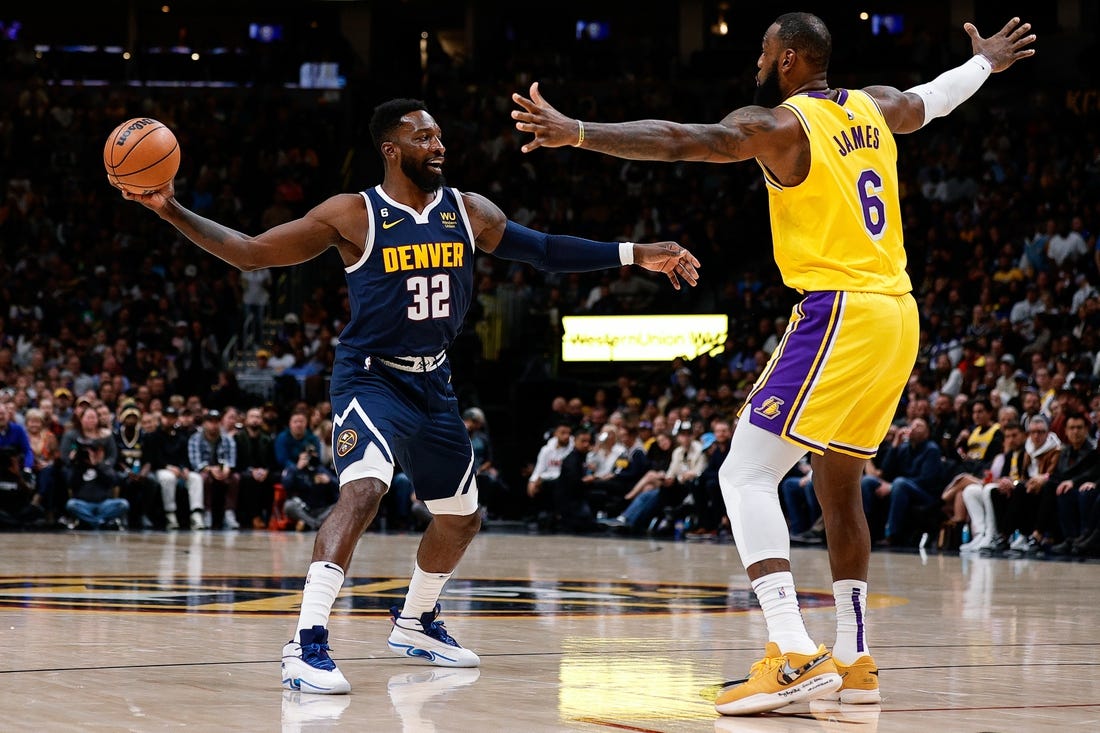 Oct 26, 2022; Denver, Colorado, USA; Denver Nuggets forward Jeff Green (32) controls the ball as Los Angeles Lakers forward LeBron James (6) guards in the fourth quarter at Ball Arena. Mandatory Credit: Isaiah J. Downing-USA TODAY Sports