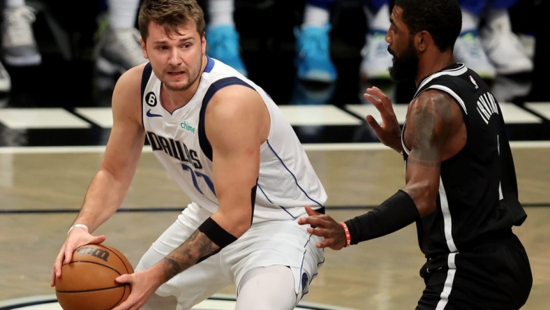 Oct 27, 2022; Brooklyn, New York, USA; Dallas Mavericks guard Luka Doncic (77) controls the ball against Brooklyn Nets guard Kyrie Irving (11) during the first quarter at Barclays Center. Mandatory Credit: Brad Penner-USA TODAY Sports