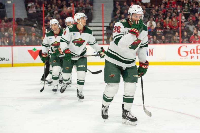 Oct 27, 2022; Ottawa, Ontario, CAN; Minnesota Wild right wing Ryan Hartman (38) skates to the bench following his goal in the second period against the Ottawa Senators at the Canadian Tire Centre. Mandatory Credit: Marc DesRosiers-USA TODAY Sports