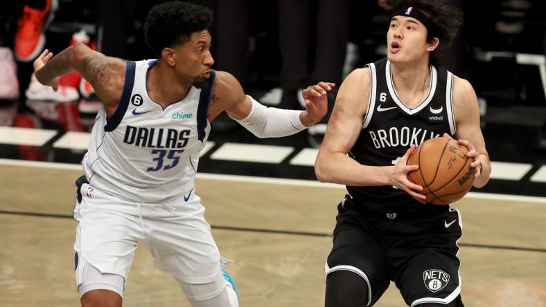 Oct 27, 2022; Brooklyn, New York, USA; Brooklyn Nets forward Yuta Watanabe (18) controls the ball against Dallas Mavericks center Christian Wood (35) during the first quarter at Barclays Center. Mandatory Credit: Brad Penner-USA TODAY Sports